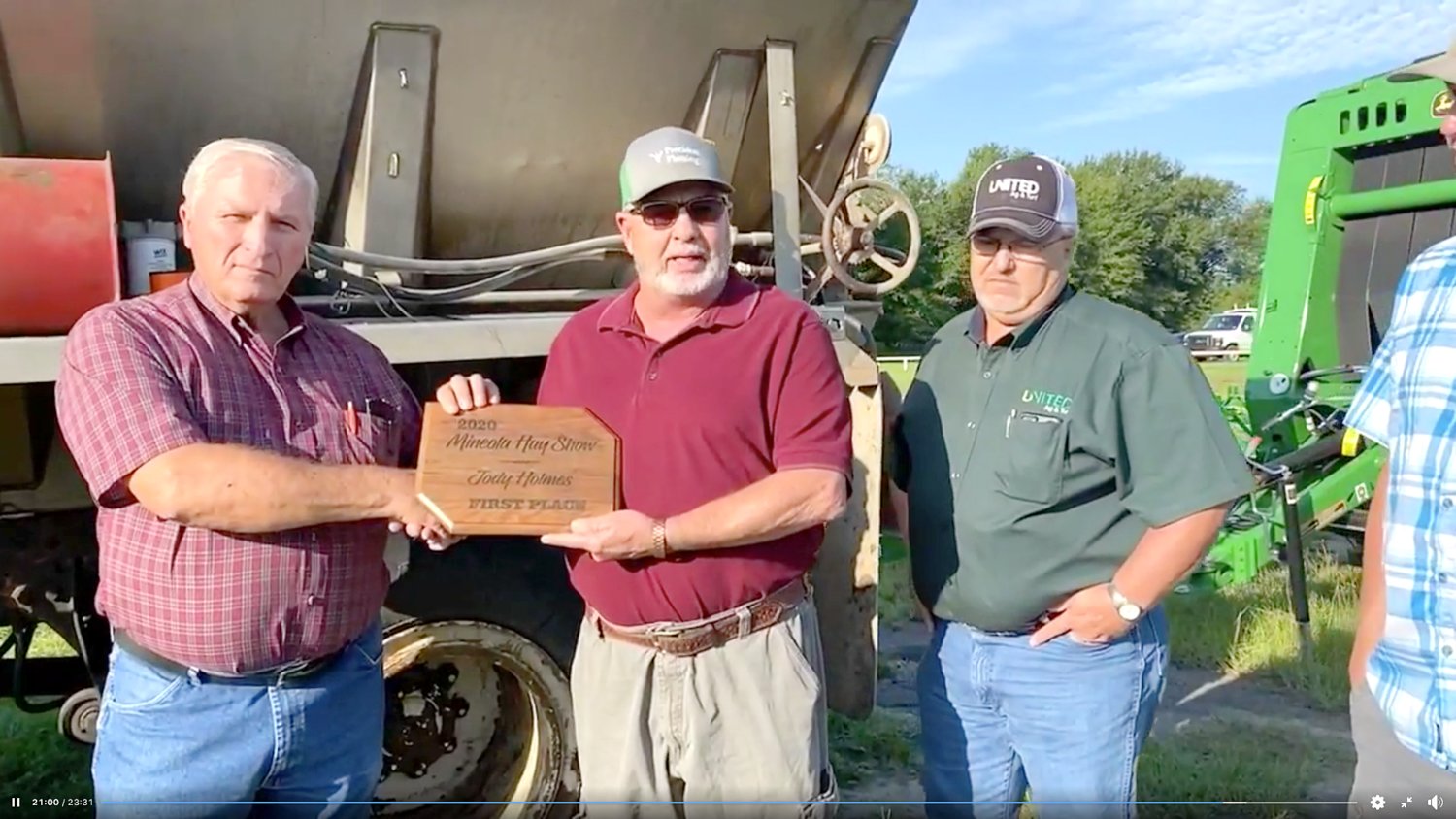 Glen Dossett, left, presents the first place winner’s plaque to Jody Holmes, center, for the 2020 Mineola Hay Show, along with Bob Madsen with United Ag and Turf in Mineola. (Courtesy photo)